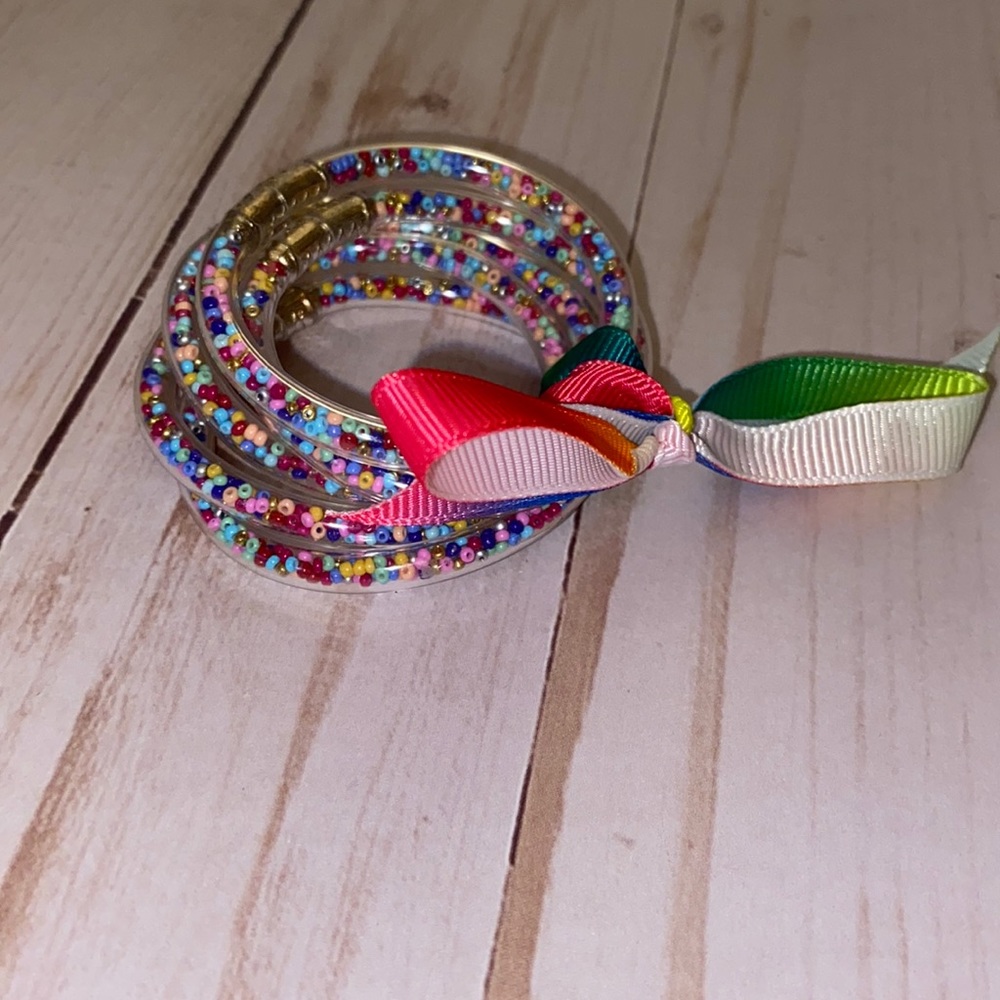 Little girls clear rubber rainbow confetti bracelets